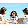 group of happy child on beach who have fun and play games