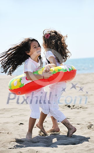 group of happy child on beach who have fun and play games group of happy child on beach who have fun and play games