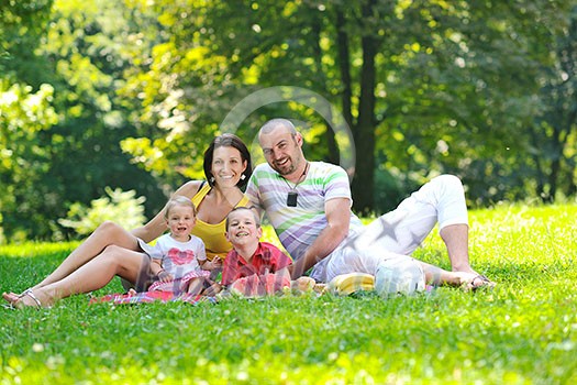 happy young couple with their children have fun at beautiful park outdoor in nature happy young couple with their children have fun at beautiful park outdoor in nature