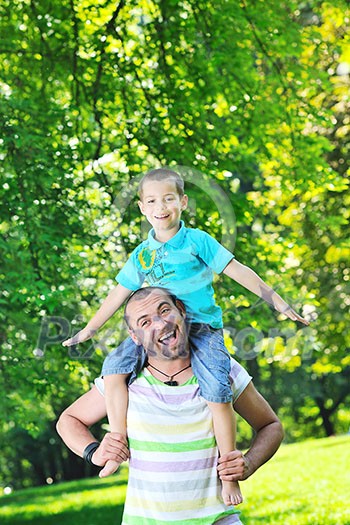 family father and son have fun at park on summer season and representing happines concept family father and son have fun at park on summer season and representing happines concept