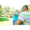 family father and son have fun at park on summer season and representing happines concept