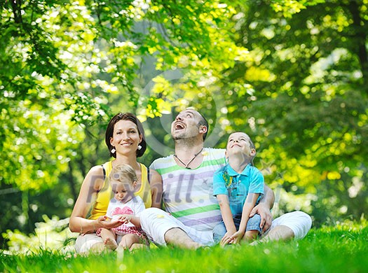 happy young couple with their children have fun at beautiful park outdoor in nature happy young couple with their children have fun at beautiful park outdoor in nature