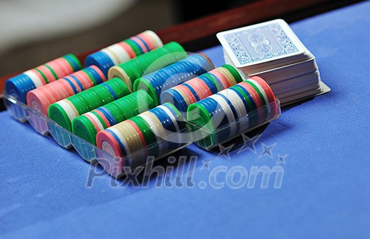 woman play black jack card game in casino on blue table woman play black jack card game in casino on blue table