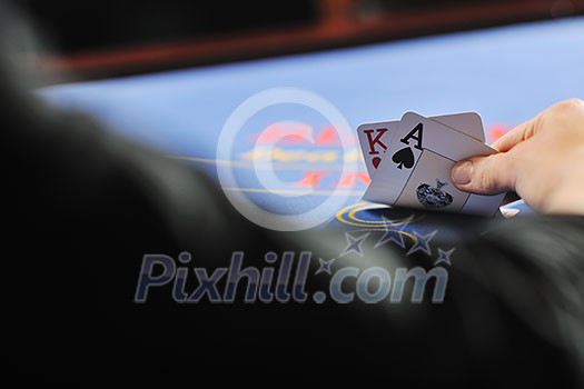 woman play black jack card game in casino on blue table woman play black jack card game in casino on blue table