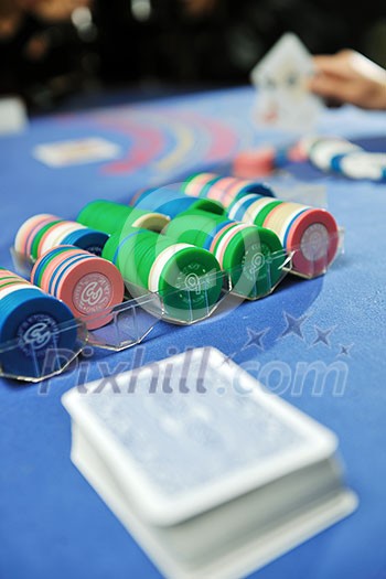 woman play black jack card game in casino on blue table woman play black jack card game in casino on blue table