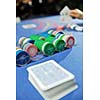 woman play black jack card game in casino on blue table