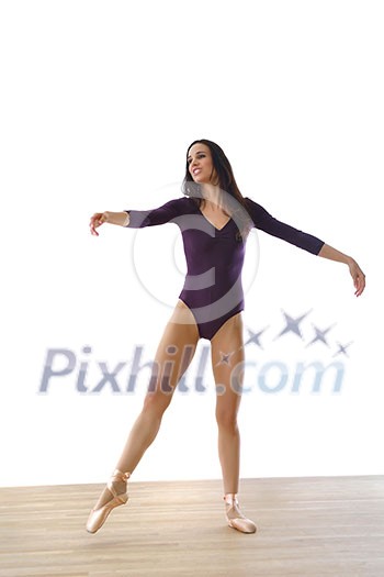 modern style ballet dancer posing and jumping on training