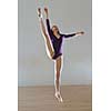 modern style ballet dancer posing and jumping on training