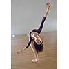 modern style ballet dancer posing and jumping on training