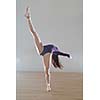 modern style ballet dancer posing and jumping on training