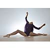 modern style ballet dancer posing and jumping on training
