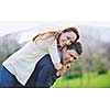 happy young couple have good time and fun outdoor at beautiful sunny day