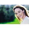 happy young beautiful woman face closeup and portrait outdoor at sunny day
