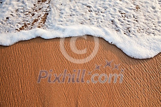 Wave surging on sand on beach Wave surging on sand on beach