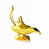 Golden Aladdin magic genie lamp isolated on white