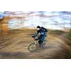 Bicycle riding in a city park on a lovely autumn/fall day (motion blur is used to convey movement)