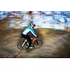 Bicycle riding in a city park on a lovely autumn/fall day (motion blur is used to convey movement)
