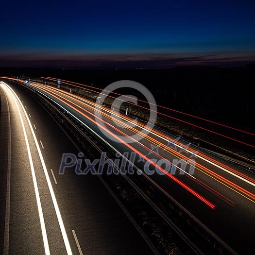 Cars moving fast on a highway Cars moving fast on a highway