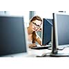 Pretty, female student looking at a desktop computer screen, learning unpleasant news about her exam results. University/office/school concept
