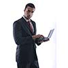 Smiling business man hold and work on mini laptop comuter   Isolated on white background in studio