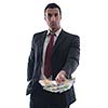 Portrait of a business man holding and catch falling money bills, isolated on white background in studio