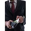 Portrait of a business man holding and catch falling money bills, isolated on white background in studio