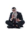 Portrait of a business man holding and catch falling money bills, isolated on white background in studio