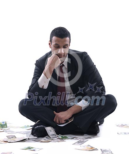 Portrait of a business man holding and catch falling money bills, isolated on white background in studio Portrait of a business man holding and catch falling money bills, isolated on white background in studio