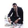 Portrait of a business man holding and catch falling money bills, isolated on white background in studio