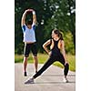 young health couple doing stretching exercise relaxing and warm up after jogging and running in park
