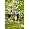 young health couple doing stretching exercise relaxing and warm up after jogging and running in park