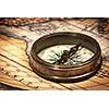 Old vintage retro compass on ancient map