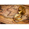 Old vintage retro golden compass on ancient map