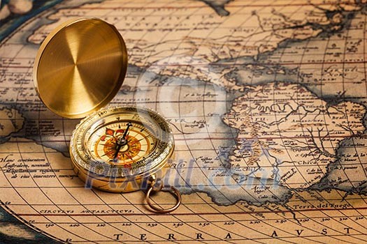 Old vintage retro golden compass on ancient map Old vintage retro golden compass on ancient map