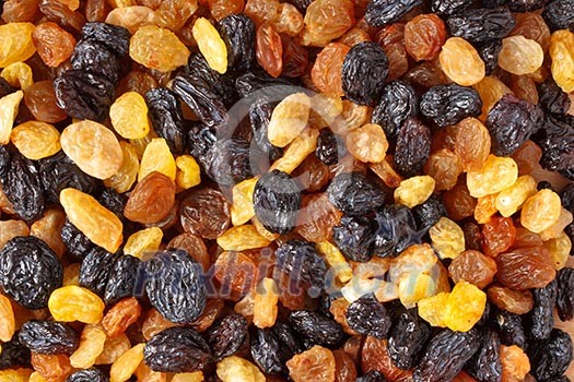 Mixed raisins of different colors close up Mixed raisins of different colors close up
