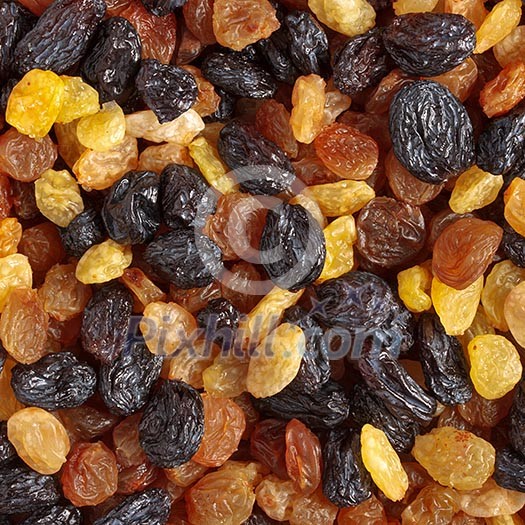 Mixed raisins of different colors close up Mixed raisins of different colors close up
