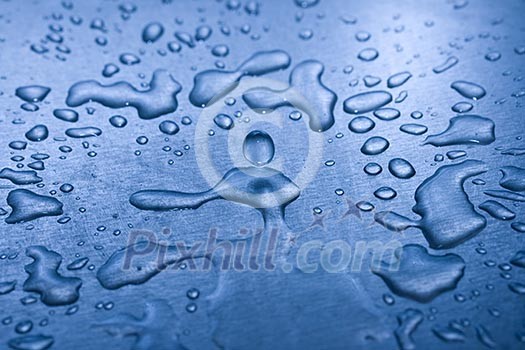 Water droplets on metal background macro blue tinted Water droplets on metal background macro blue tinted