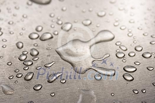 Water droplets on metal background macro Water droplets on metal background macro