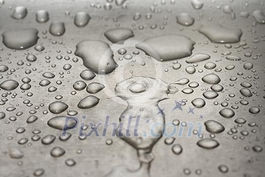 Water droplets on metal background macro Water droplets on metal background macro