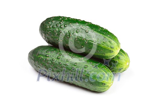 Three green cucumbers isolated on white background Three green cucumbers isolated on white background