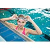 Female swimmer in an indoor swimming pool - doing crawl (shallow DOF)