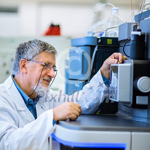 Senior male researcher carrying out scientific research in a lab (shallow DOF; color toned image) Senior male researcher carrying out scientific research in a lab (shallow DOF; color toned image)