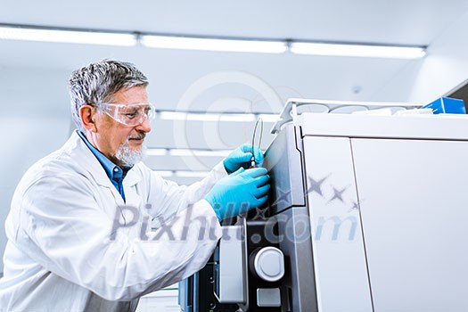 Senior male researcher carrying out scientific research in a lab (shallow DOF; color toned image) Senior male researcher carrying out scientific research in a lab (shallow DOF; color toned image)