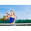 Portrait of a pretty young tennis player with copyspace