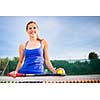 Portrait of a pretty young tennis player with copyspace