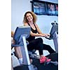 sport, fitness, lifestyle, technology and people concept - smiling woman exercising on treadmill in gym