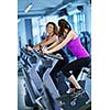 group of young people running on treadmills in modern sport  gym