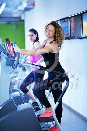 group of young people running on treadmills in modern sport gym group of young people running on treadmills in modern sport gym
