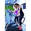 group of young people running on treadmills in modern sport  gym