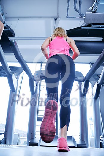 sport, fitness, lifestyle, technology and people concept - smiling woman exercising on treadmill in gym sport, fitness, lifestyle, technology and people concept - smiling woman exercising on treadmill in gym